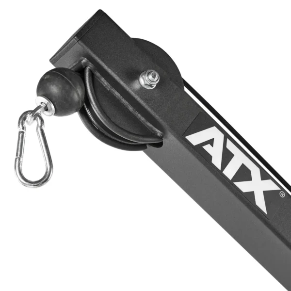 Close-up of a black and silver component from the ATX® Cable Lat Pull Down Machine, showcasing an intricate pulley system, sturdy snap hook, firm rubber stopper, and prominently displaying ATX on the side.