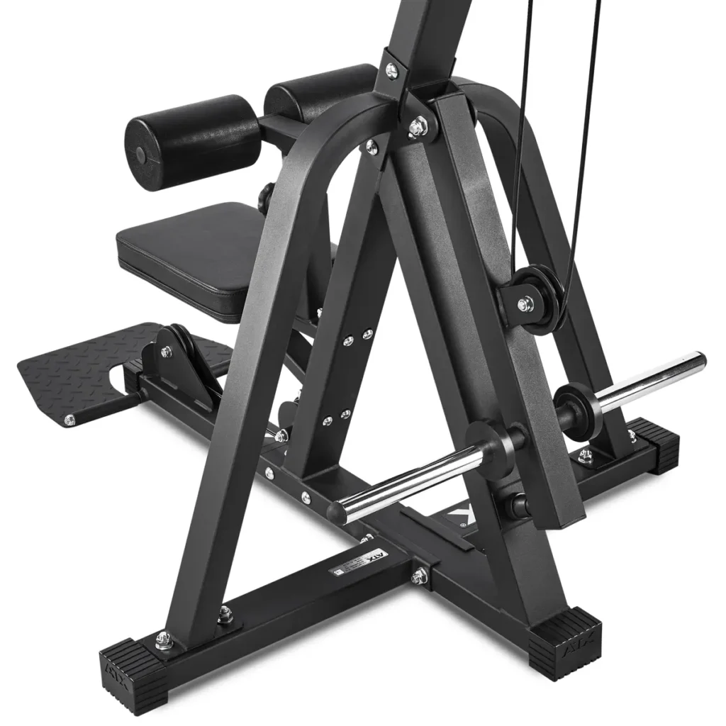 Close-up of the ATX® Cable Lat Pull Down Machine in black with padded supports, metal bars, and a footplate. The sturdy structure features multiple components for diverse exercises.