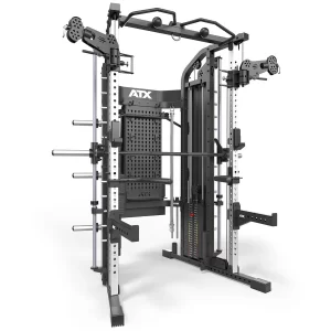 The ATX® Monster 2.0 All In One Trainer is a multifunctional gym machine featuring a power rack, cable pulleys, weight plate storage, adjustable bar hooks, and various attachments for versatile strength training. It boasts a sleek black and silver design.