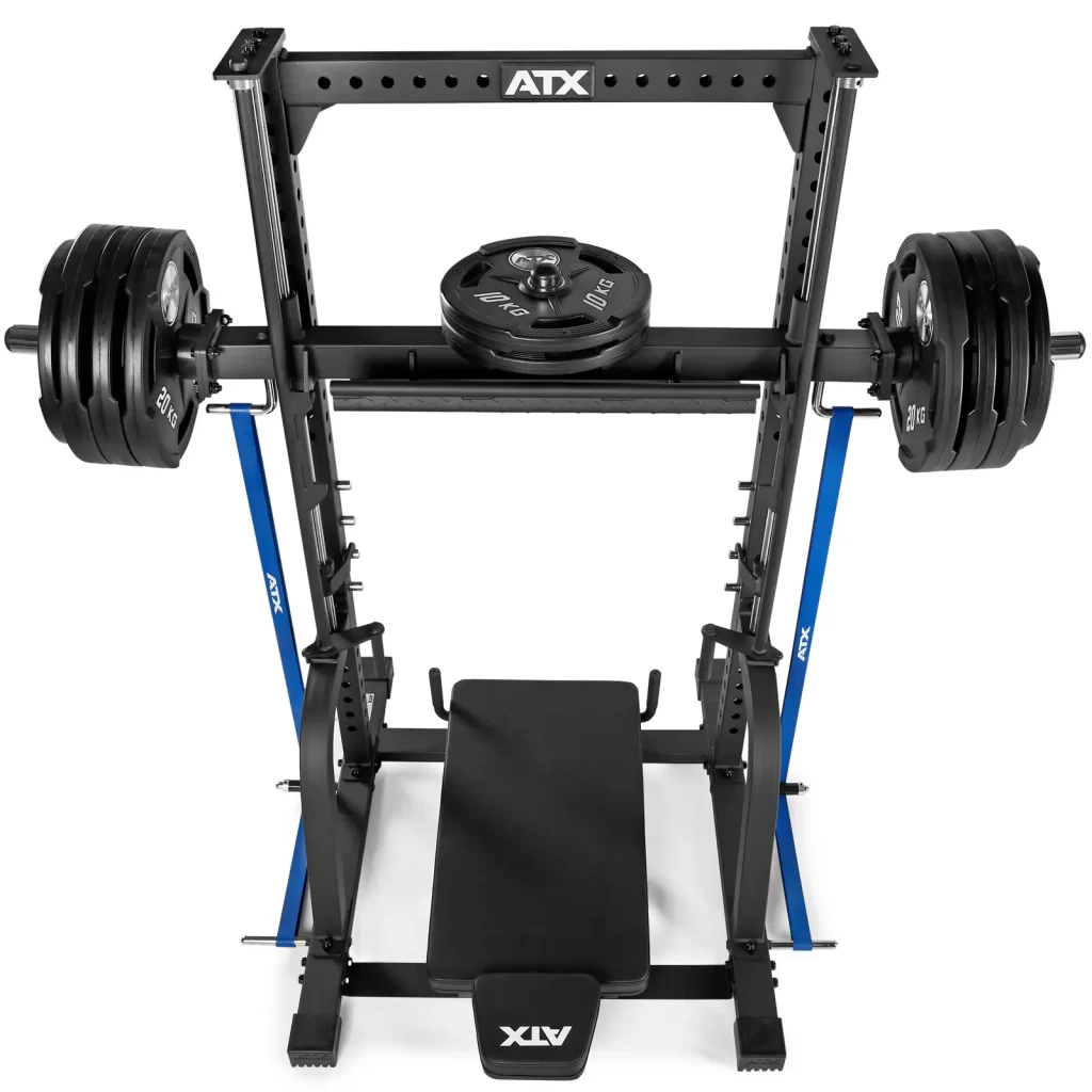 A weight bench with a loaded barbell on a squat rack. The setup includes multiple weight plates on each side and has a sturdy black frame with blue supports.