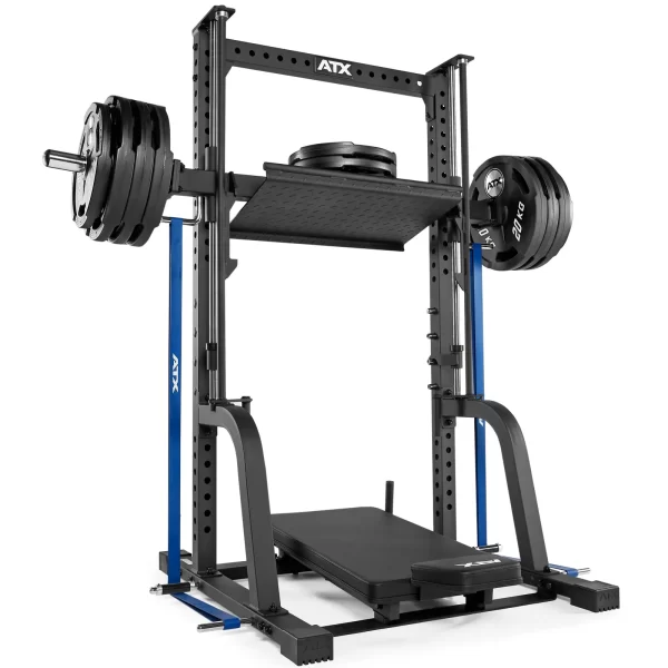 A squat and leg press machine with multiple weight plates attached. The equipment is black and blue, with adjustable pegs for various height settings, and has a compact design for gym use.
