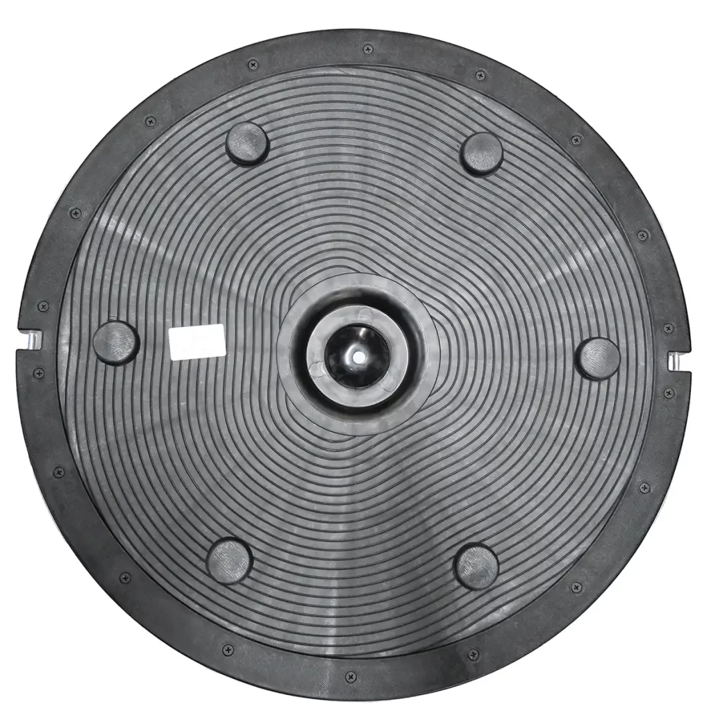 The Power Maxx Bosu Ball is a black circular rubber mat with concentric ridges, six evenly spaced raised bumps, and a central metal hub, likely designed for stability or grip.