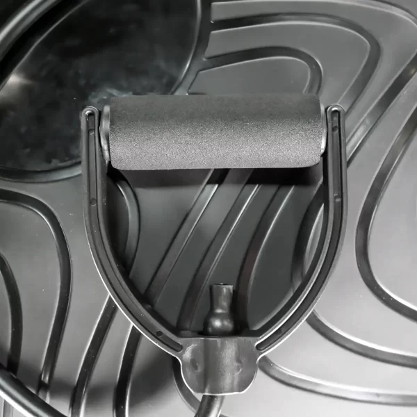 Close-up of the Power Maxx Bosu Ball, featuring a black foam roller with a curved plastic handle against an abstract patterned background.