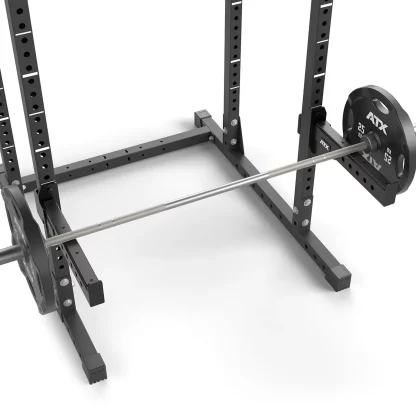 Loaded Olympic barbell resting on 60x60 spotter arms, 500kg load rating, ensuring safety during heavy lifts