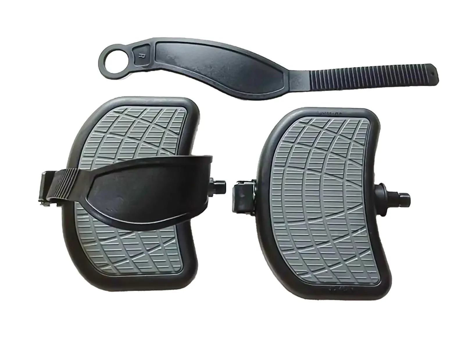 Two Spin Bike Pedal 9/16 exercisers feature a black curved design, textured gray surface, and adjustable straps. A circular-handled black strap is positioned above them for use with stationary bikes or similar equipment.